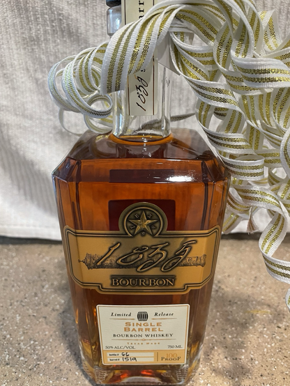 750 ml bottle of 1835 single barrel bourbon whiskey 100 proof; Bottle 66, Barrrel 1519. There is a ribbon on the neck of the bottle. 