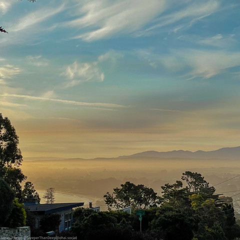 A morning photo of the Monterey bay lapping against the city; Santa Lucia mountains in the background. What a morning!