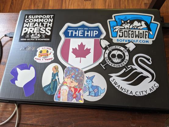 A photo of my laptop, covered in stickers, but still with some room for more