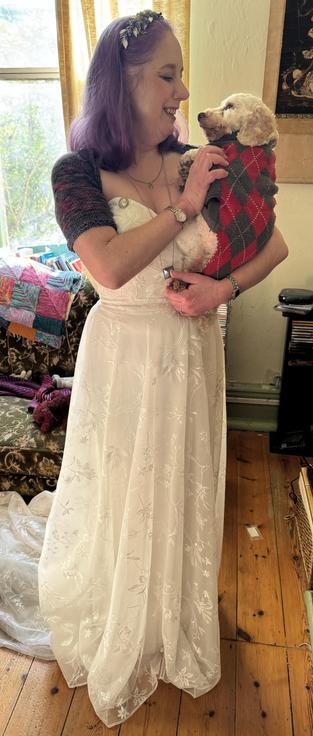 My bride holding our small white dog, Winston 