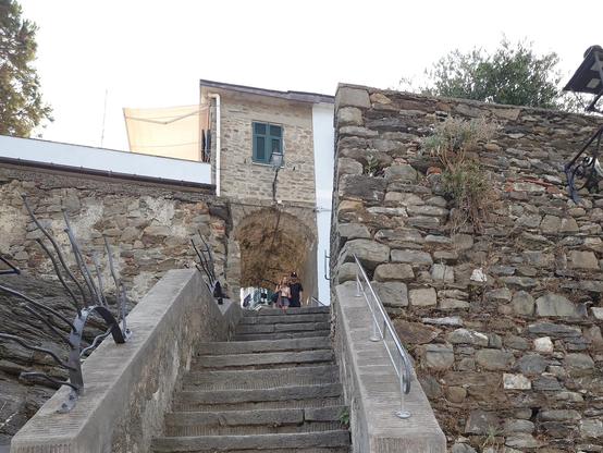 A stair and an house arch on top