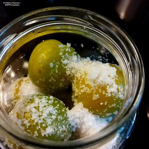 Whole greengages and coarse sea salt in a jar to start boshi.