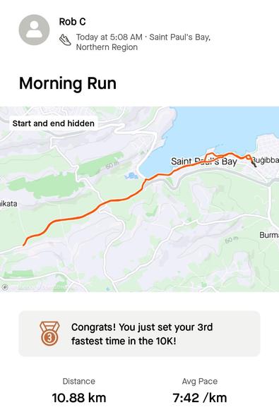 Screenshot of today's run from my Strava app (for a change).The little topographic map is titled 'Morning Run' and the man shows the route line in orange than runs from the East of St Paul's Bay out to the West, and a hamlet called Balut, in Manikata and then back. Underneath is a little bronze medal to show this was my 3rd fast 10k of all time, which is 1.15.56.
7.36 m/km. Under that the overall distance of 10.88km is displayed at an average pace of 7.42 m/km... jacking right off when I passed the 10km mark.