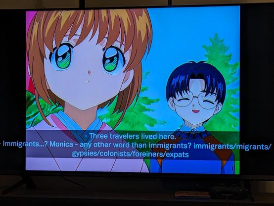 A screenshot of the anime Cardcaptor Sakura with Eriol speaking to Sakura about his house. The subtitles read 