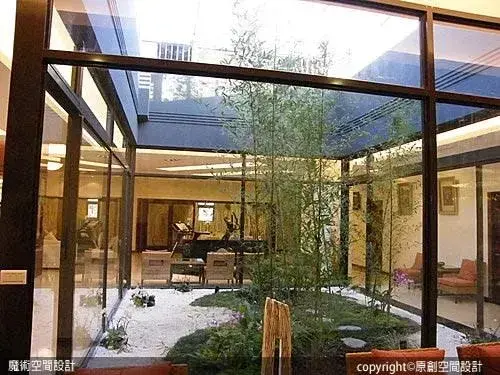 A tianjing indoor courtyard, done in classical Chinese 竹、海、島 bamboo sea and island style, which would in turn give rise to much of the formal Japanese garden style, which I call 京都庭園 == Kyoto-garden style.   