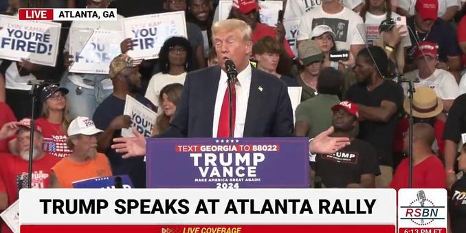 Dotard Donny lying in front of a small crowd in Atlanta.