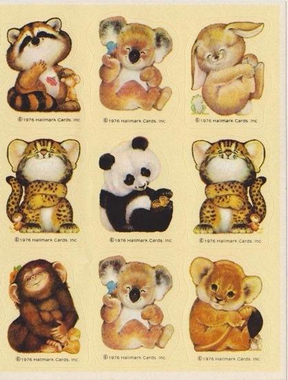 A sheet of nine cute animal stickers including a raccoon, koala, bunny, leopard, panda, monkey, and lion cub. Copyright Hallmark 1976