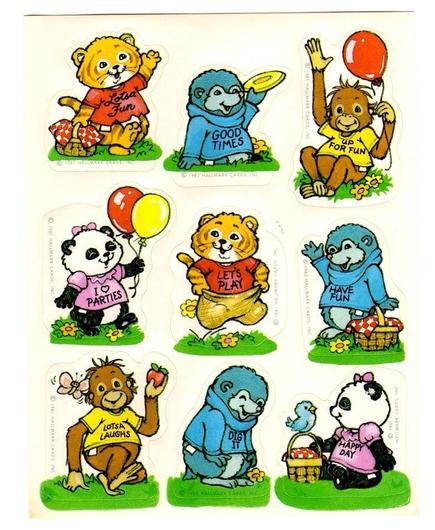 Set of nine stickers of cute animals wearing shirts. Top row: Tyg Tiger holding a picnic basket, his shirt says “Losta Fun,” Digger Mole holding a frisbee, his turtleneck says “Good Times, Bogey Orangutan holding a red balloon, his shirt says “Up For Fun.”
Middle row: Pammy Panda holding two balloons, her shirt says “I heart Parties,” Tyg Tiger in a potato sack, his shirt says “Let’s Play,” Digger Mole waving next to a picnic basket, his turtleneck says “Have Fun.”
Bottom row: Bogey Orangutan holding an apple, his shirt says “Lotsa Laughs,” Digger Mole’s turtleneck says “Dig It,” Pammy Panda sitting with picnic basket and little bird, her shirt says “Happy Day.” Copyright Hallmark 1982