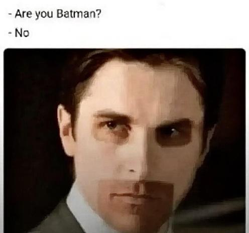 Meme: an image of actor Christian Bale looking intensely toward the left of frame. Someone has photoshopped medium brown rectangles framing each eye, and also one larger rectangle around his mouth and chin. They are the exact shape and in the exact relative position of where the openings in the BatMask are. The caption reads as a question and answer: “Are you Batman?” “No.”