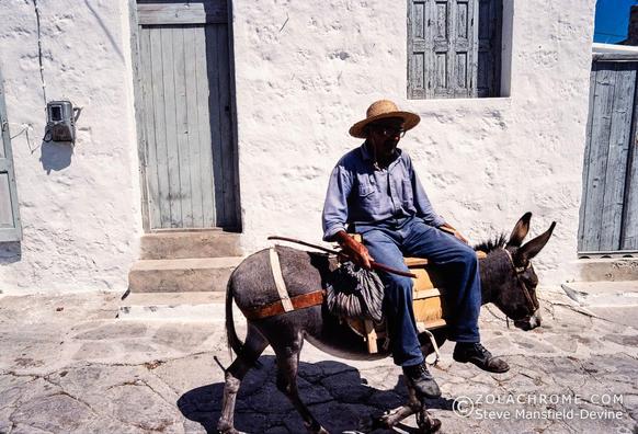 Man riding a donkey, Kimilos, Greek Islands