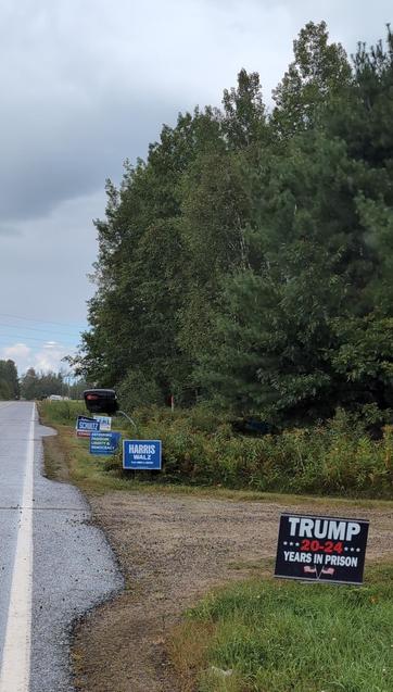 political signs with the first one stating 