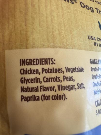 Image of a food packaging label listing ingredients for dog treats: chicken, potatoes, vegetable glycerin, carrots, peas, natural flavor, vinegar, salt, and paprika (for color).