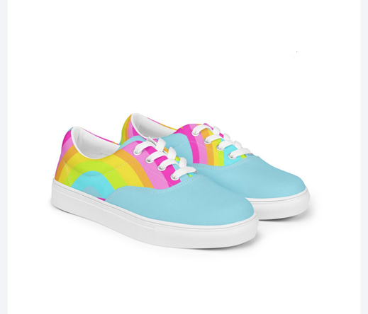 Pastel coloured rainbow shapes on light blue canvas shoes