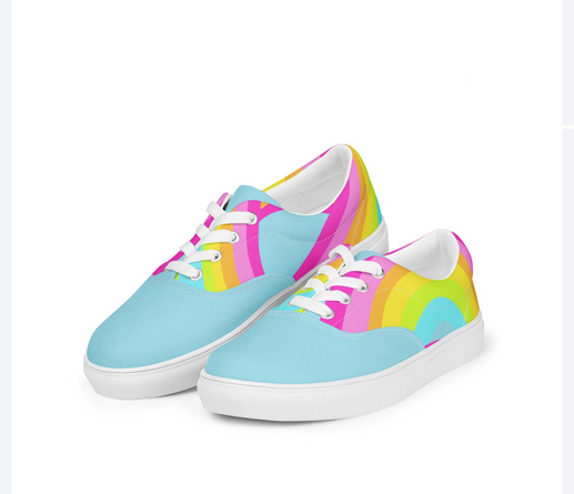 Pastel coloured rainbow shapes on light blue canvas shoes