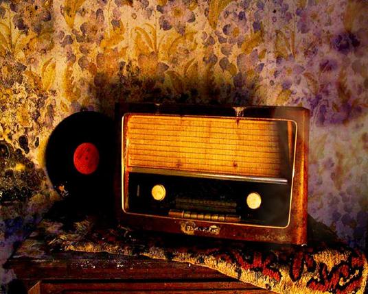 An old fashioned radio in an ancient house, possibly a strange ghostly face stars out of the faded wallpaper patterns 