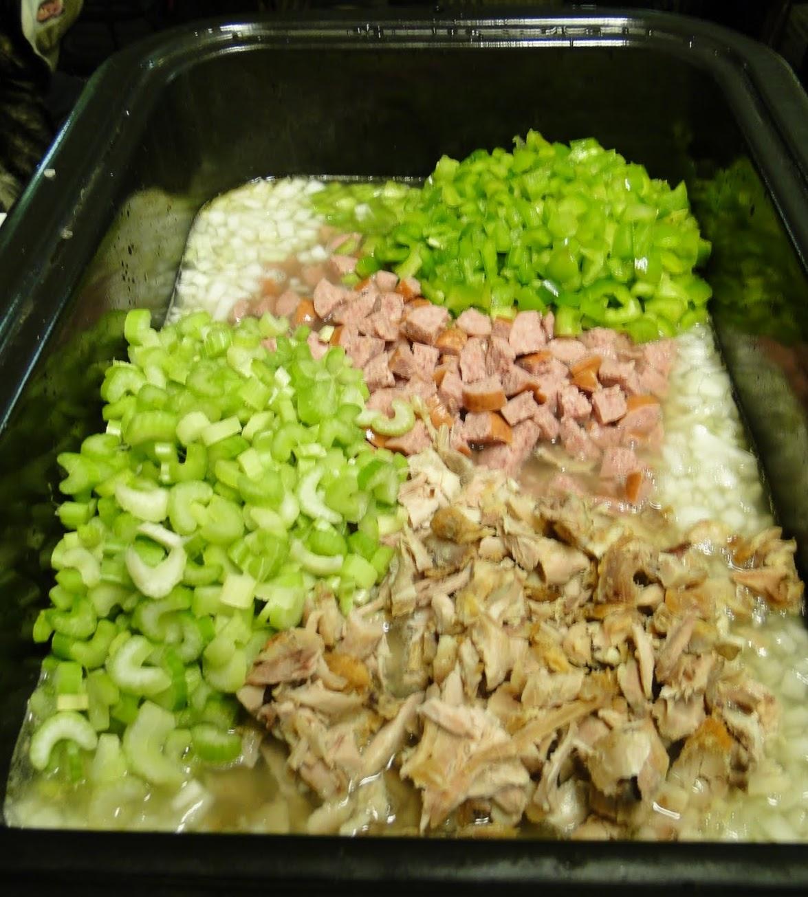 Celery, bell pepper, onion, beef sausage, dark meat chicken thighs, all chopped fine, in the roasting pan.