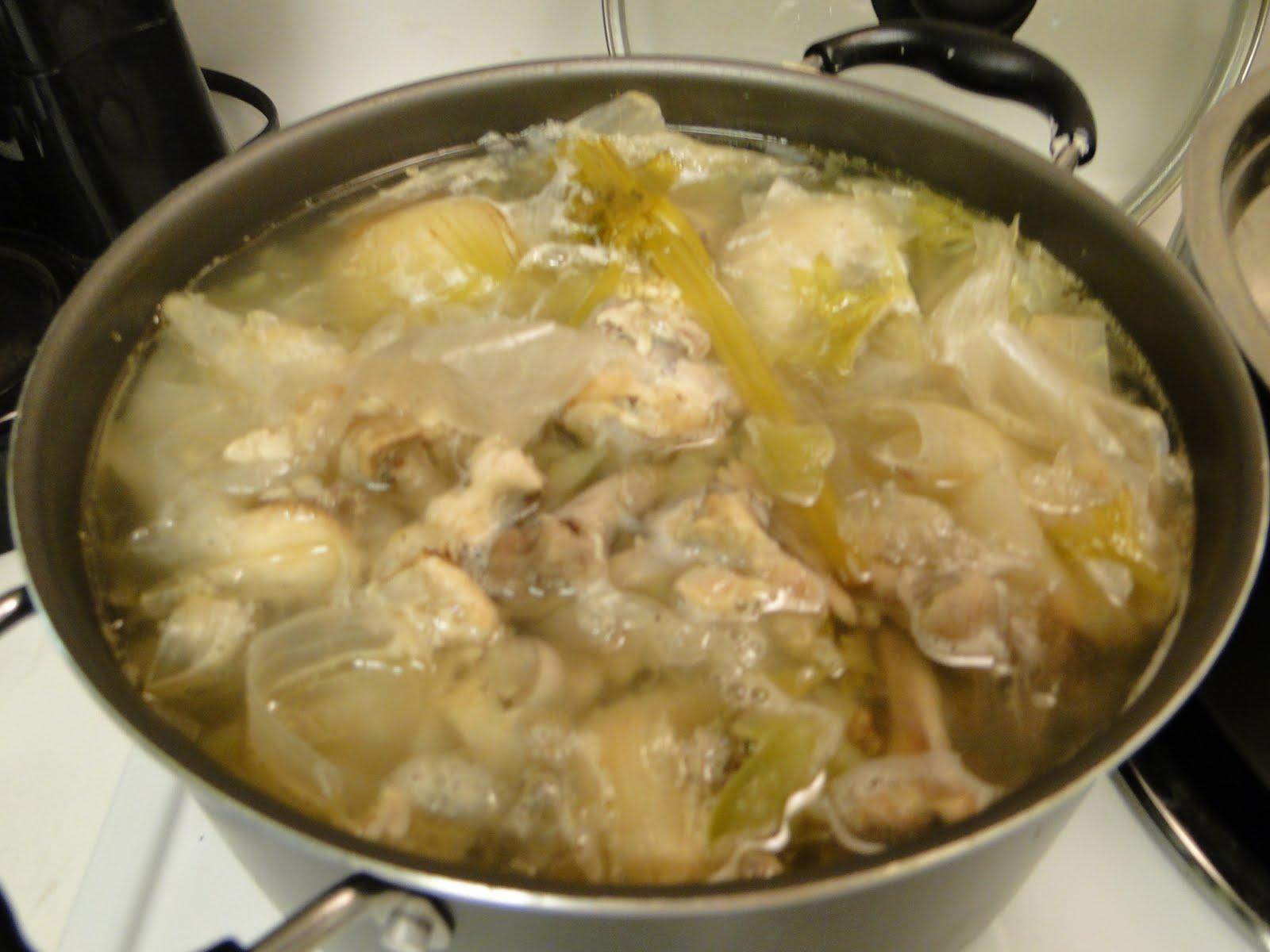 The chicken skins, bones and drippings, boiling in hot water. Run through a sieve into the roasting pan