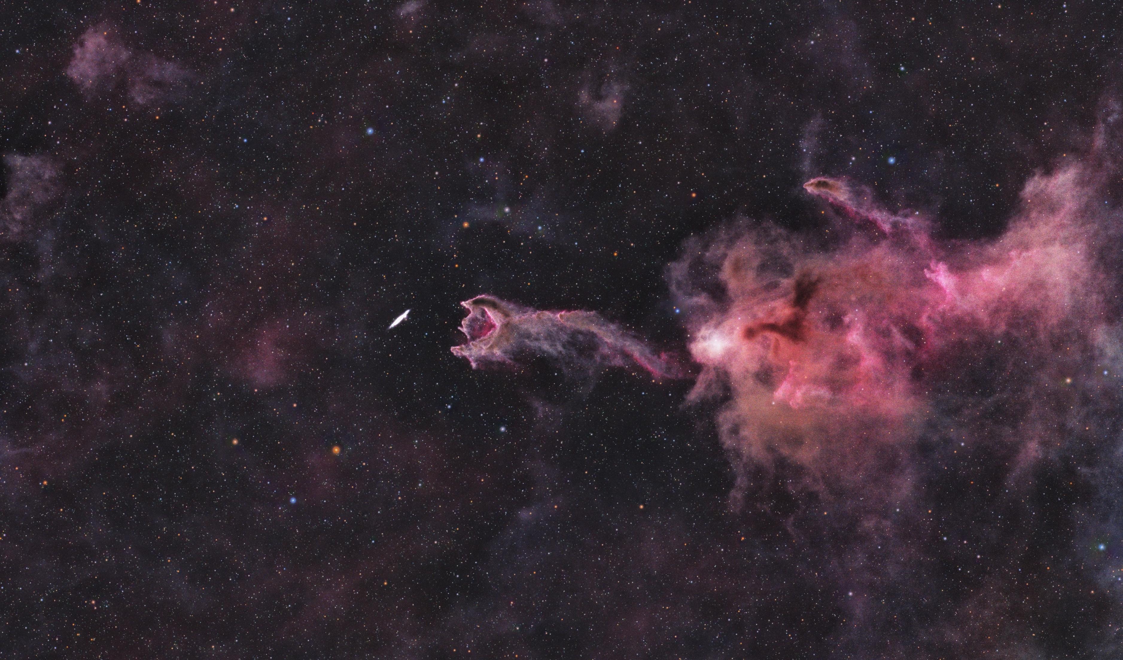 Image of the star-forming region CG 4 (“God’s Hand”) — 1,300 light years away — which appears as a hand on an outstretched arm (or perhaps an open-mouthed creature with a long neck) extending from a luminous gas cloud in hues of pink and purple, in a field of hazy gases and multicolored stars. The “hand” or “mouth” appears to reach out to seize or devour a small spiral galaxy — ESO 257-19, which in reality is over 100 million light years further away. (H/t Wikipedia)

Data taken from the Amateur Astronomers Association’s Gateway Remote Telescope. Processed and edited by me using Siril, Starnet, and GIMP, with final edits in Snapseed.