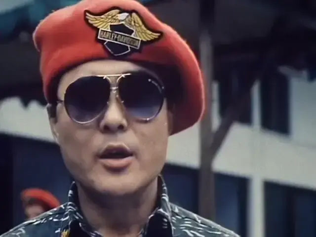 Solider in Thunder of Gigantic Serpent, beret has Harley Davidson badge on it