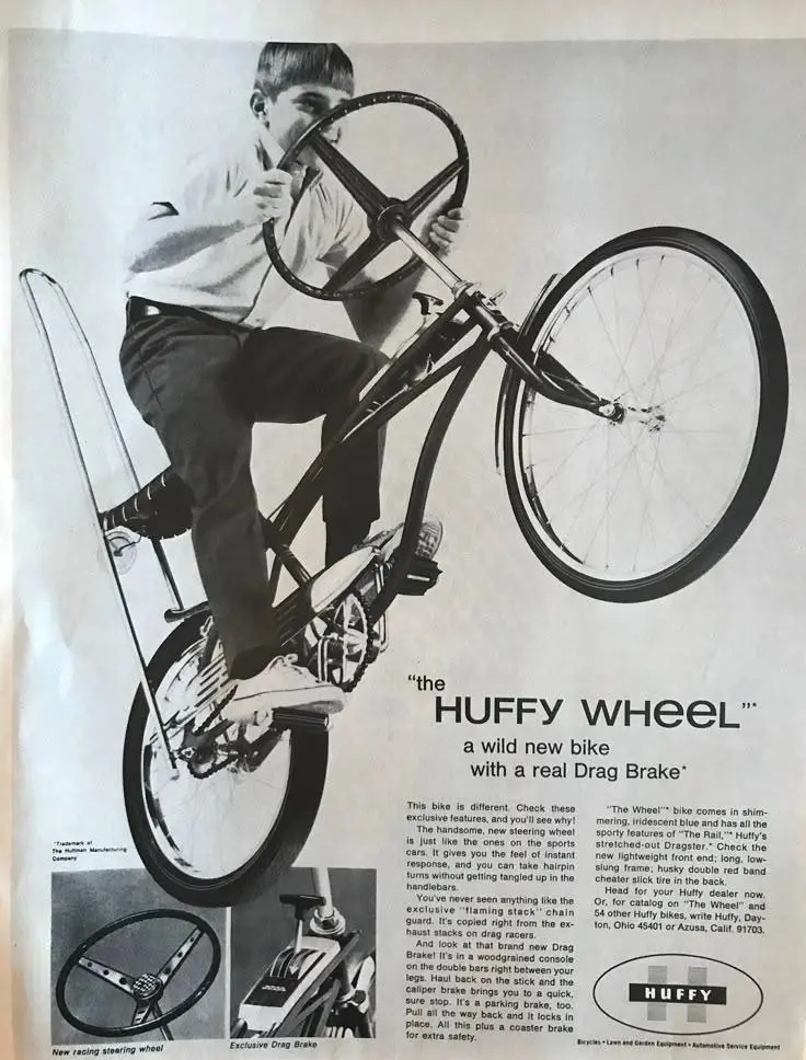 An old print ad for a Huffy bicycle with a steering wheel instead of handle bars and what looks like a shifter on the cross bar that is actually a hand brake.